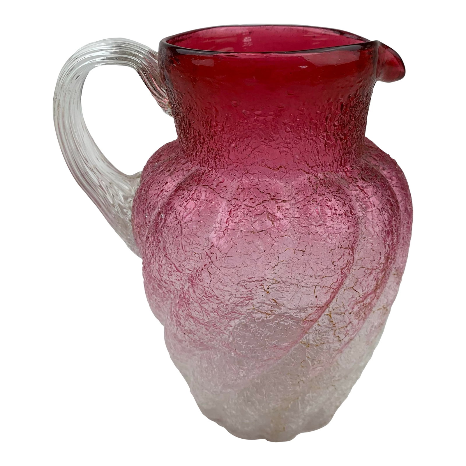 1960s Vintage Rose Hued Glass Pitcher: An enchanting rose-colored glass pitcher, with a softly faded blush hue. The body has gentle curves connected to a fluted clear glass handle. Condition: Alterations: Original Condition Unaltered