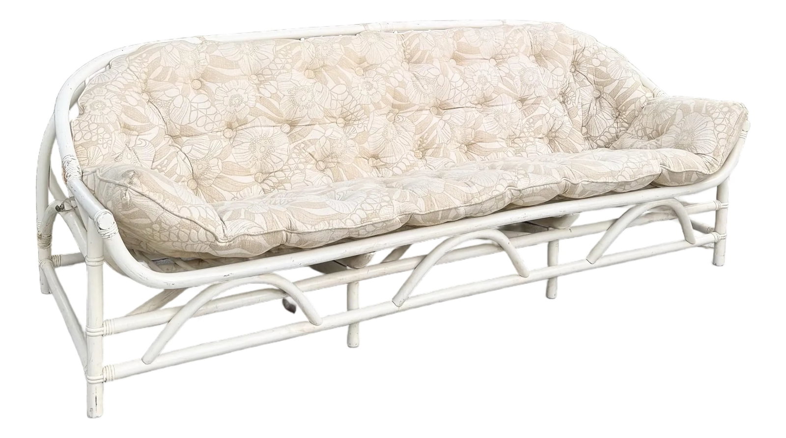 Vintage Coastal Clark Casual Bent Rattan Tufted Sofa: A breezy vintage sofa by Clark Casual, crafted from elegantly bent rattan with smooth coastal curves and a cream finish. The plush tufted cushion features a soft beige floral pattern, perfectly