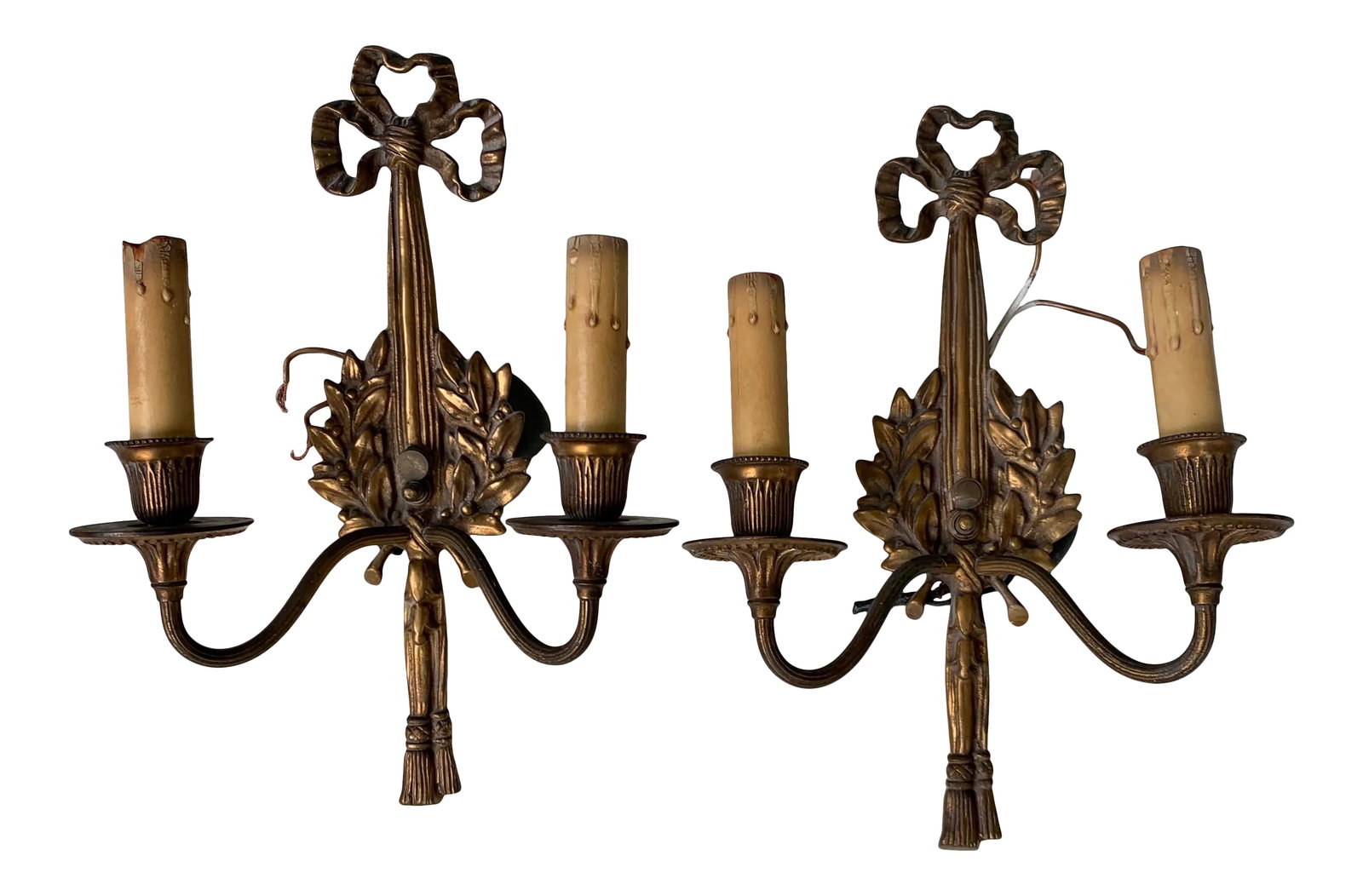 Vintage Early 20th Century Italian Brass Sconces - a Pair: Pair of brass sconces with ribbon motif. Formally hung in the Southern California estate used in the 1980s hit TV show "Dynasty" Condition: Alterations: Original Condition Unaltered Imperfections: