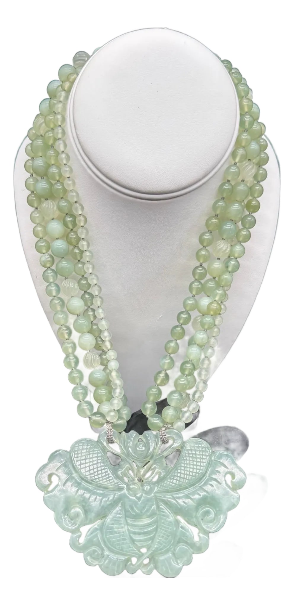1970s Chinese Export Jadeite Moth Pendant Multi Strand Beaded Necklace: Beautiful Multi-Strand Light Green Jadeite Beaded Necklace. Traditional design in Chinese pieces. Multiple strands of round beads in various sizes, twisted, and leading down to a large flat carved