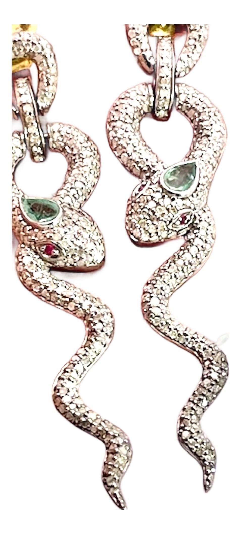 Silver Snake Long Earrings Green Stone Eyes, A Pair: These earrings are done in Silver with green stones for the head and two red stones for eyes. These earrings are not fine jewelry these are costume jewelry earrings with a punch. As so many of you