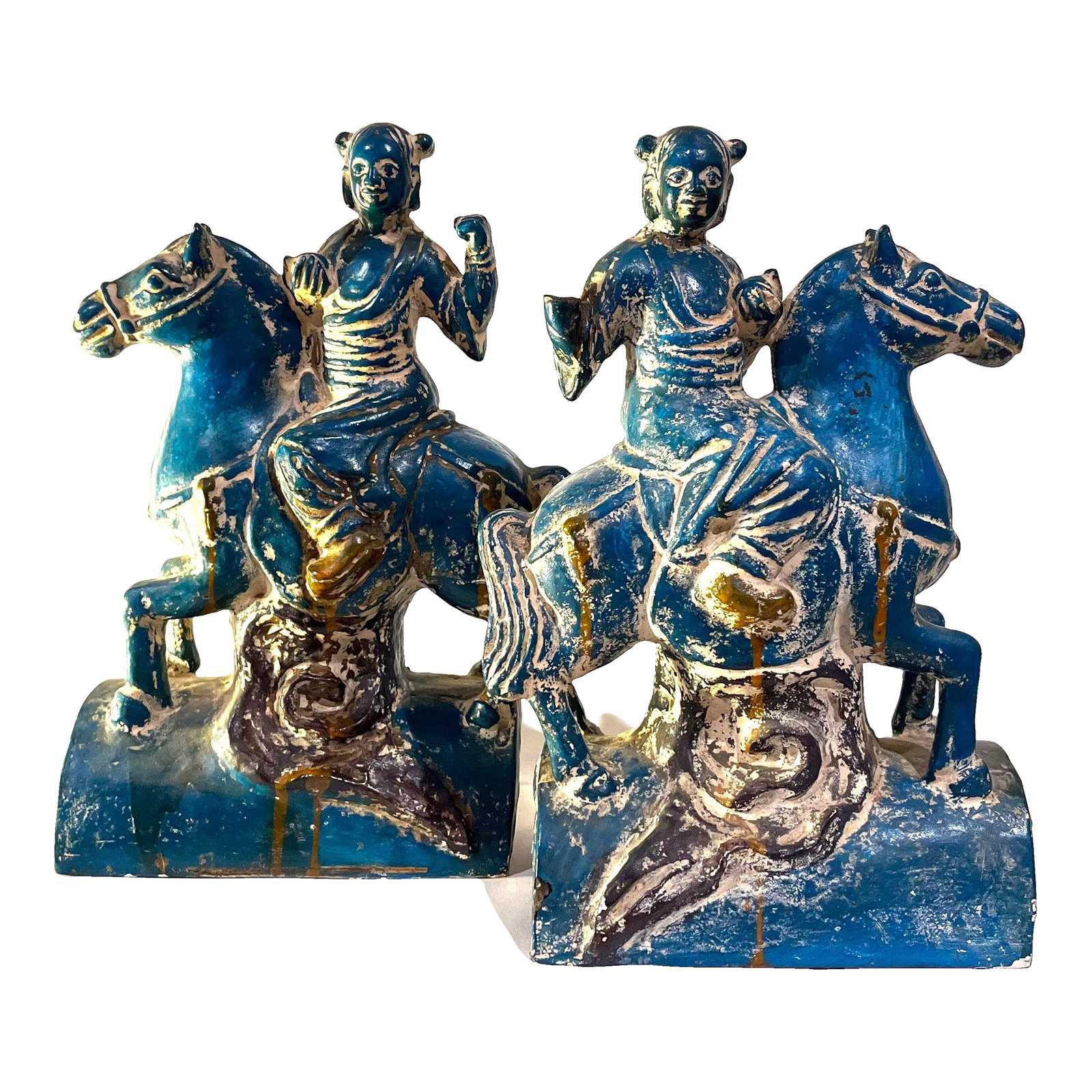 1950's Chinoiserie Stoneware Turquoise Teal Tang Warriors on Horses - Pair: Striking bold pair of vintage glazed stoneware figurines. Based on ancient Chinese Tang Dynasty examples - each features a Chinese warrior sitting atop their horse. Pearched upon an arched based that