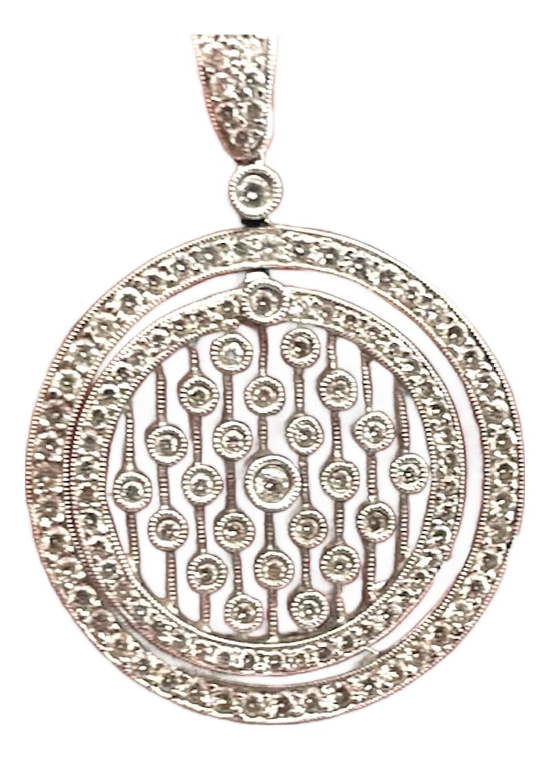 Diamond Circle Pendant Necklace 18k: This elegant 18K white gold (750) diamond pendant necklace features a stunning circular medallion design with intricate open-work detailing. The pendant showcases a double-layered round frame, with