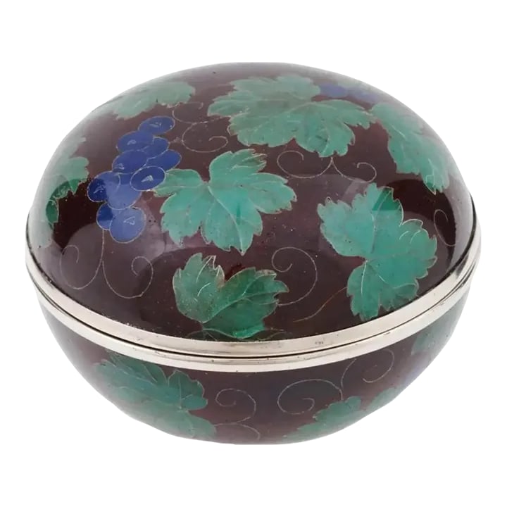 Early 20th Century Japanese Covered Grape Plique a Jour Enamel Kogo Box: A Japanese covered silvered and enamel kogo or box for incense. The box is enameled with polychrome images of grape vines with berries made in the Plique a Jour technique on burgundy ground. Marked