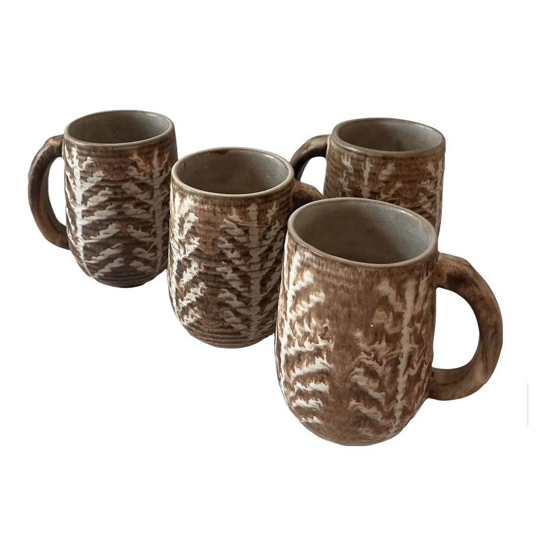 Set of 4 Mid Century Ceramic Glazed Stoneware Coffee Mugs by Design Technics: Beautiful set of 4 glazed and stoneware mugs by Design Technics. Handled mugs have a generous size and carved organic tree design likely by Nancy Wickham (1923-1987). Marked on bottom. Condition: