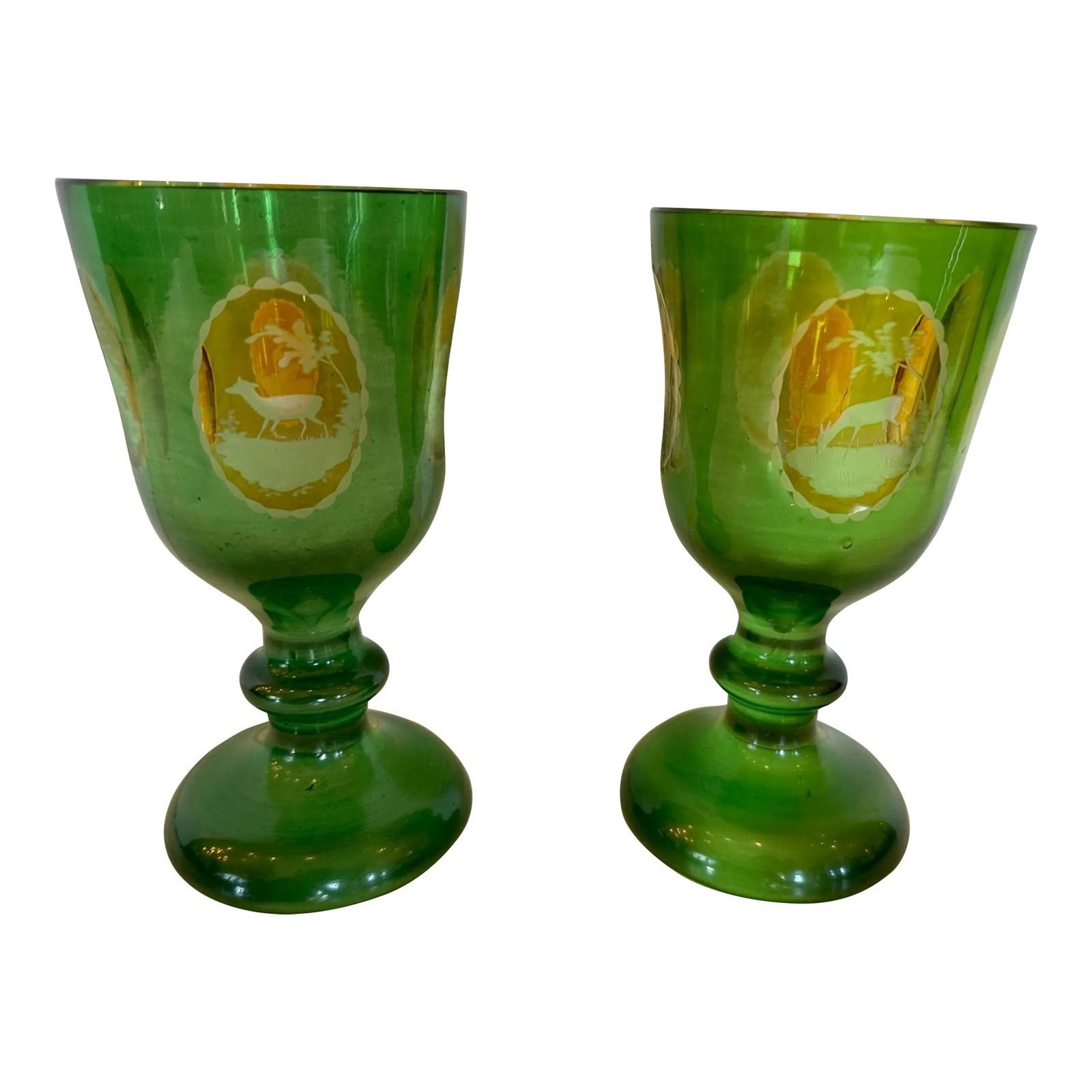 Antique Czech Bohemain Overlay Glass Goblets -A Pair: The Goblets have a brilliant green coloring and offer four yellow intaglio panels depicting architecture and wildlife scenes. Made in Czech Republic Condition: Alterations: Original Condition