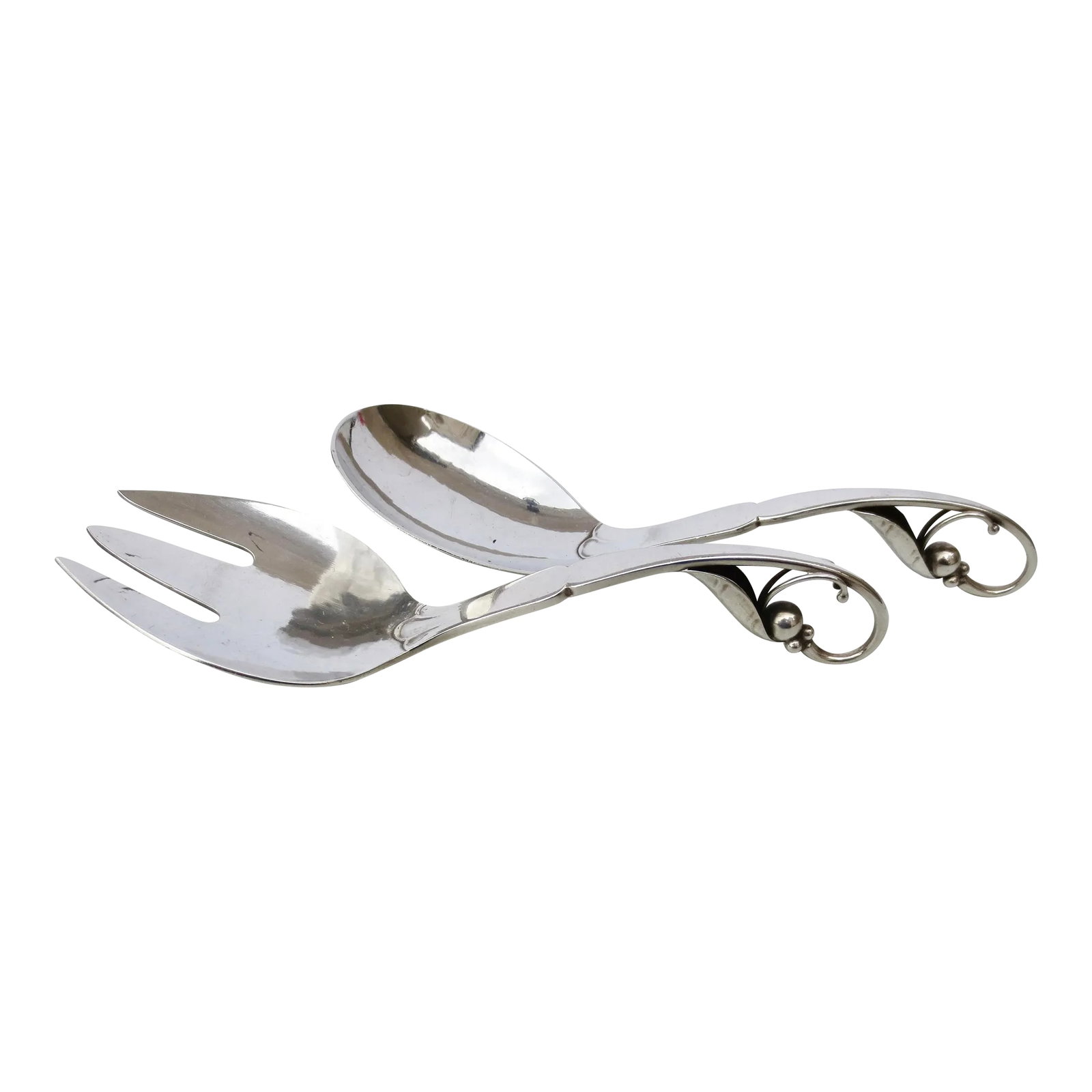 Georg Jensen Pea Pod Serving Set Sterling Silver - a Set of 2: Pea Pod design post-1945 date. Sterling silver set of serving spoon and fork. The measurements are 6.75" long and weigh 4 ounces. Beautiful Art Deco design from Jensen Hallmarked to the back. INV 64th