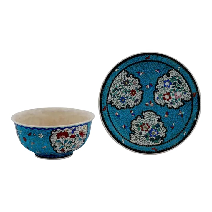 Late 19th Century Japanese Cloisonne Meiji Totai Enamel on Porcelain Bowl Plate Set- 2 Pieces: An antique Japanese, late Meiji era, covered Totai porcelain set of a saucer, and a bowl. The wares are covered with polychrome enamel medallions with flowers surrounded by floral, foliage, and