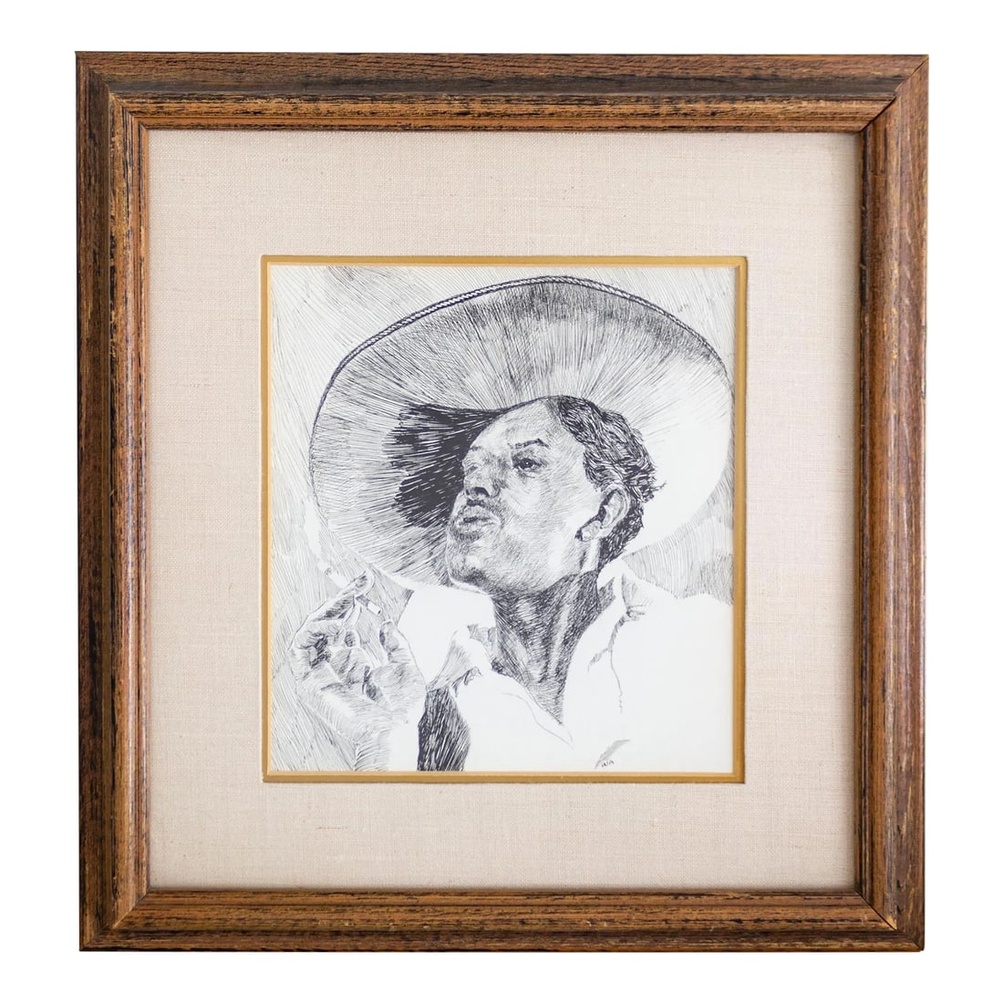 Early 20th Century Pen and Ink Portrait by Weldon Amerine: An early 20th-century pen and ink portrait of a man in profile, smoking a cigarette while wearing a wide-brimmed hat. This piece is professionally framed in a walnut frame with a wide linen mat and a