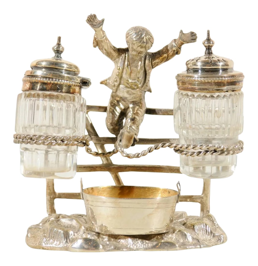 Circa 1873 English Silverplate Cruet Set of Young Boy Leaping in the Air: An English figurative silver plated cruet set, registered 1873 with young boy joyously jumping for joy. This charming late 19th century silver cruet set features an elegantly dressed young boy, his