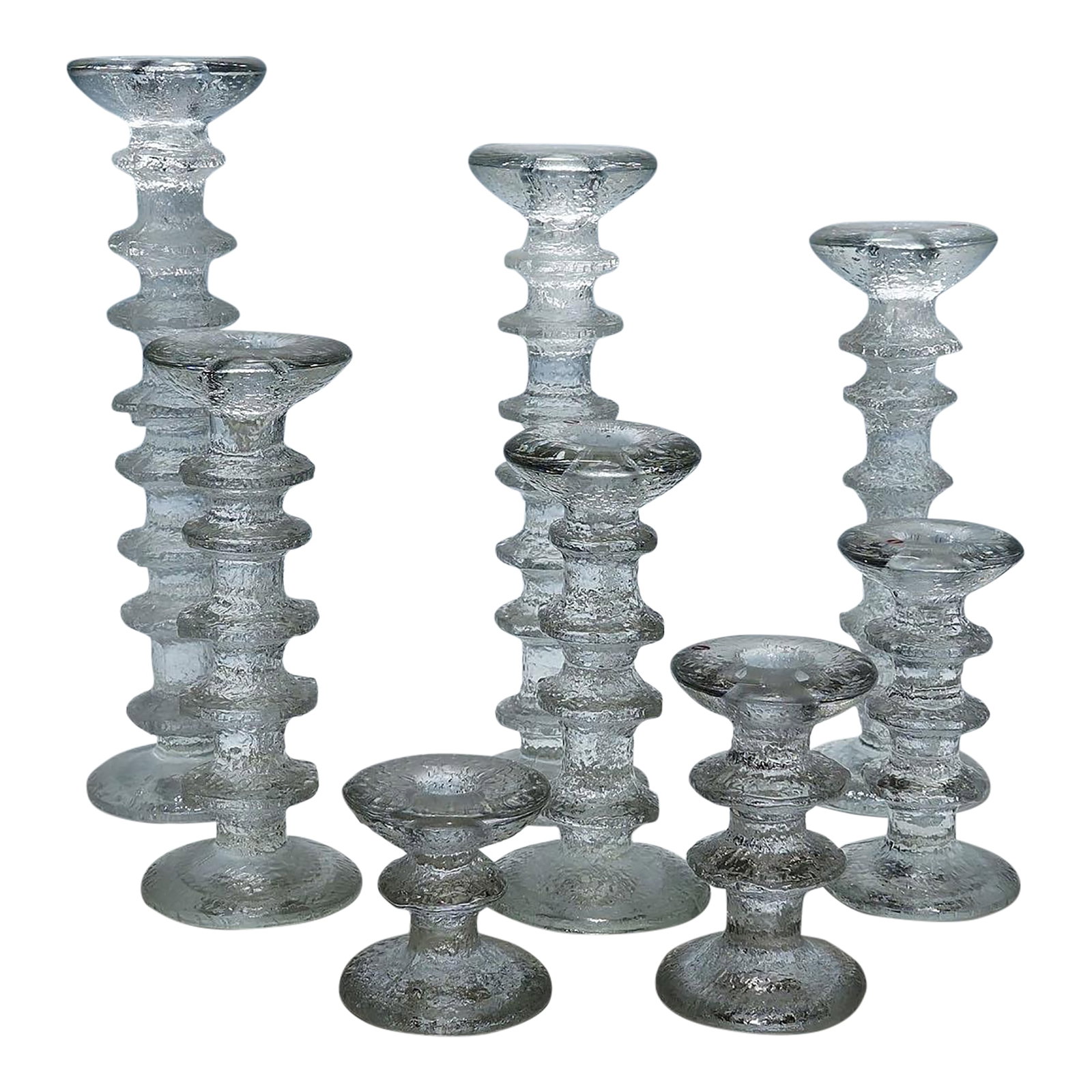 Vintage Festivo Candle Sticks by Timo Sarpaneva for Iittala: Vintage Festivo Candle Sticks by Timo Sarpaneva for Iittala A vintage set of eight Festivo candle sticks designed by Timo Sarpaneva for Iittala in 1966. A total of 8 different heights were made that