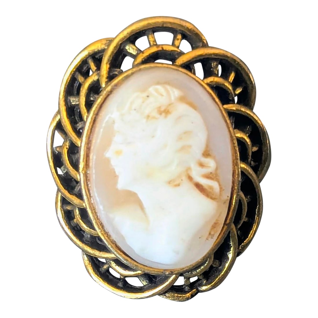 Coral Cameo Ring Framed in Brass Chunky Baroque Filigree: Brass cameo carved shell chiseled came encased in brass. The band is adjustable medium to large. Condition: Alterations: Original Condition Unaltered Imperfections: Some Imperfections Condition