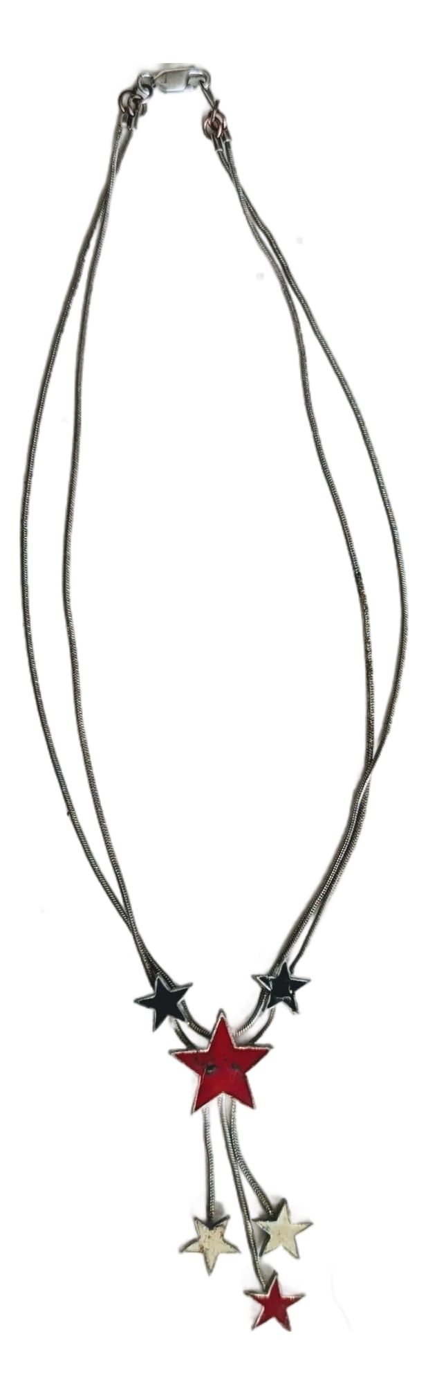 Silver Necklace Bolo With Iconic 70's Style Stars: Pretty double stranded silver with enamel stars at the ends. See condition remarks. If it's not silver, it is very convincing. The stars are encased in silver, 70's. Condition: Alterations: Original