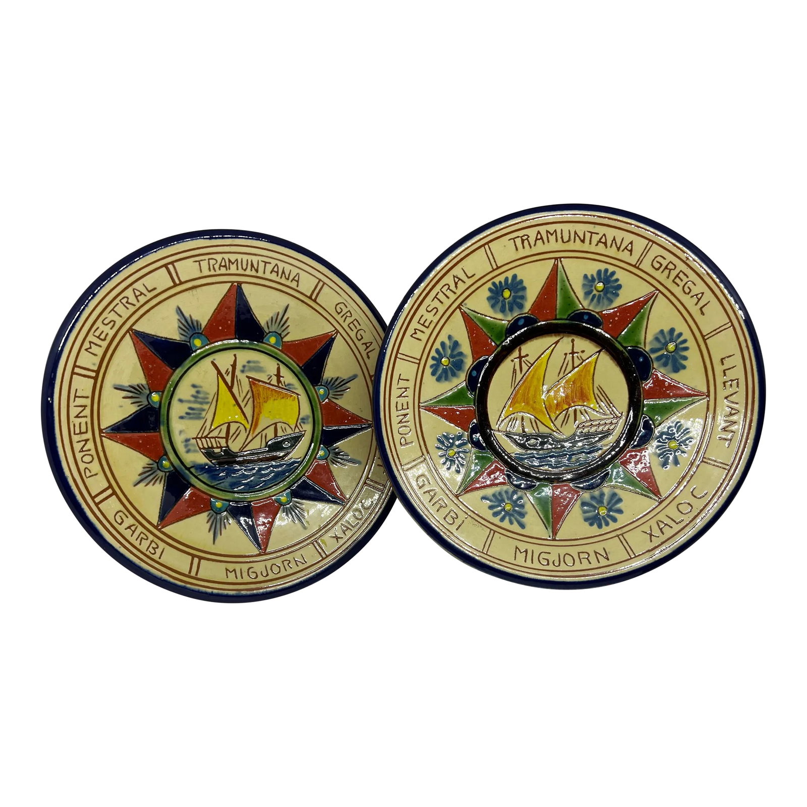 1960s Puigdemont Pottery Plates Depicting Boats With Sails- a Pair: These beautiful plates /wall hangings are significant in that, the subject matter is very rare for Puigdemont. You will find lots of painted fish and other animals but it is extremely rare to see a