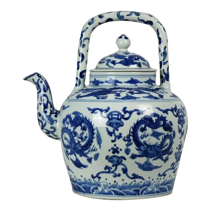 Large Chinese Porcelain Teapot with Marking on the Bottom: This exquisite Chinese porcelain teapot features an elegant and bold design in classic cobalt blue and white. Beautifully hand-painted, the surface is richly decorated with intricate dragons in medall