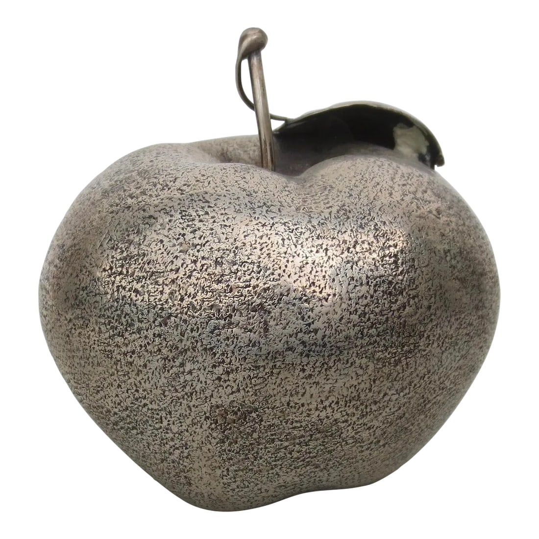 Buccellati Apple Lighter Circa 1970s': Buccellati Silver apple lighter. Hidden interior lighter compartment with Buccellati hallmarks on the bottom. Fine handmade textured surfaces with a twig and leaf attached. The lighter is now removed 