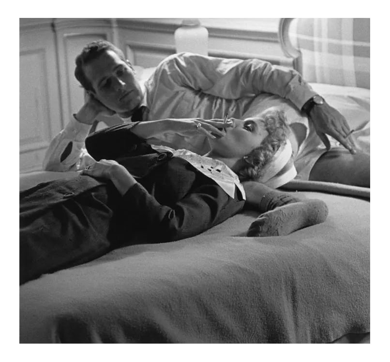 Paul Newman and Joanne Woodward 1958 (Photo by Sid Avery): Paul Newman and Joanne Woodward during a break in filming "Rally 'Round the Flag, Boys!" 1958. 11" x 14" silver gelatin fiber based print signed on verso by the photographer, Sid Avery. Edition #02