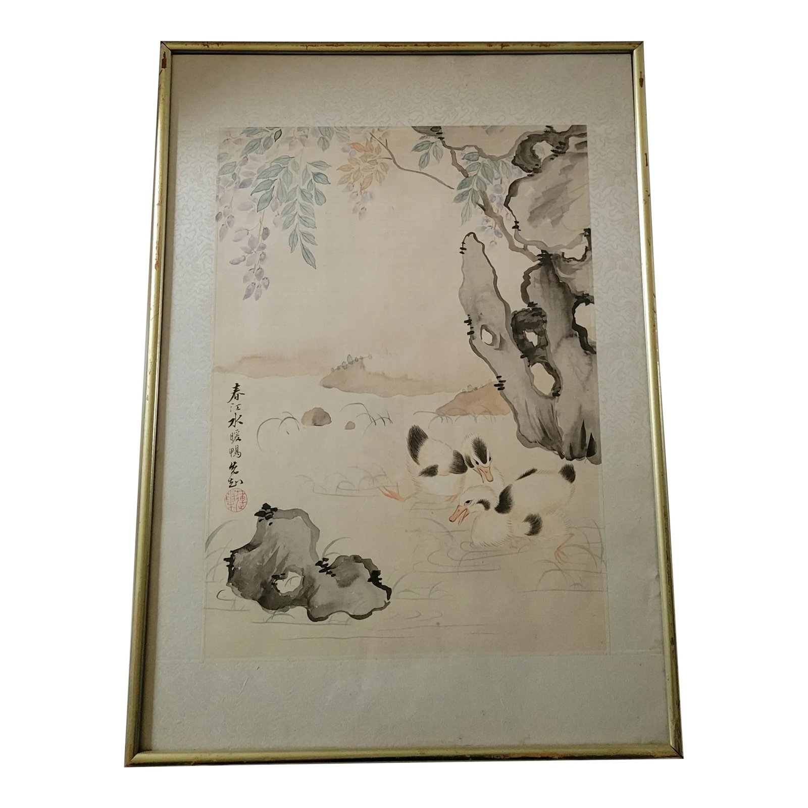 SIgned Vintage Framed Chinese Silk Watercolor Painting of Ducks: Vintage Chinese watercolor on silk art. Features a serene landscape with 2 ducks resting in a pond. Silk piece has a white embossed border, and it is framed on a wooden frame paintef gold. Artist sign
