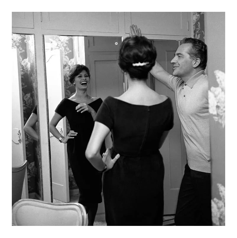 Sophia Loren and Rossano Brazzi at His Home in Beverly Hills 1958 (Photo by Sid Avery): Sophia Loren and Rossano Brazzi at his home in Beverly Hills, California, 1958. 11" x 14" silver gelatin fiber based print signed on verso by the photographer, Sid Avery. Edition #14 out of 70.