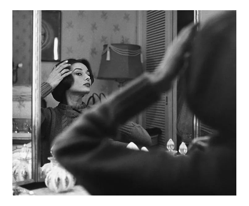 Audrey Hepburn at Her Dressing Room Mirror 1957: Audrey Hepburn at her dressing room mirror, 1957. 11" x 14" silver gelatin fiber based print signed on verso by the photographer, Sid Avery. Edition #04 out of 70. Condition: Imperfections: No