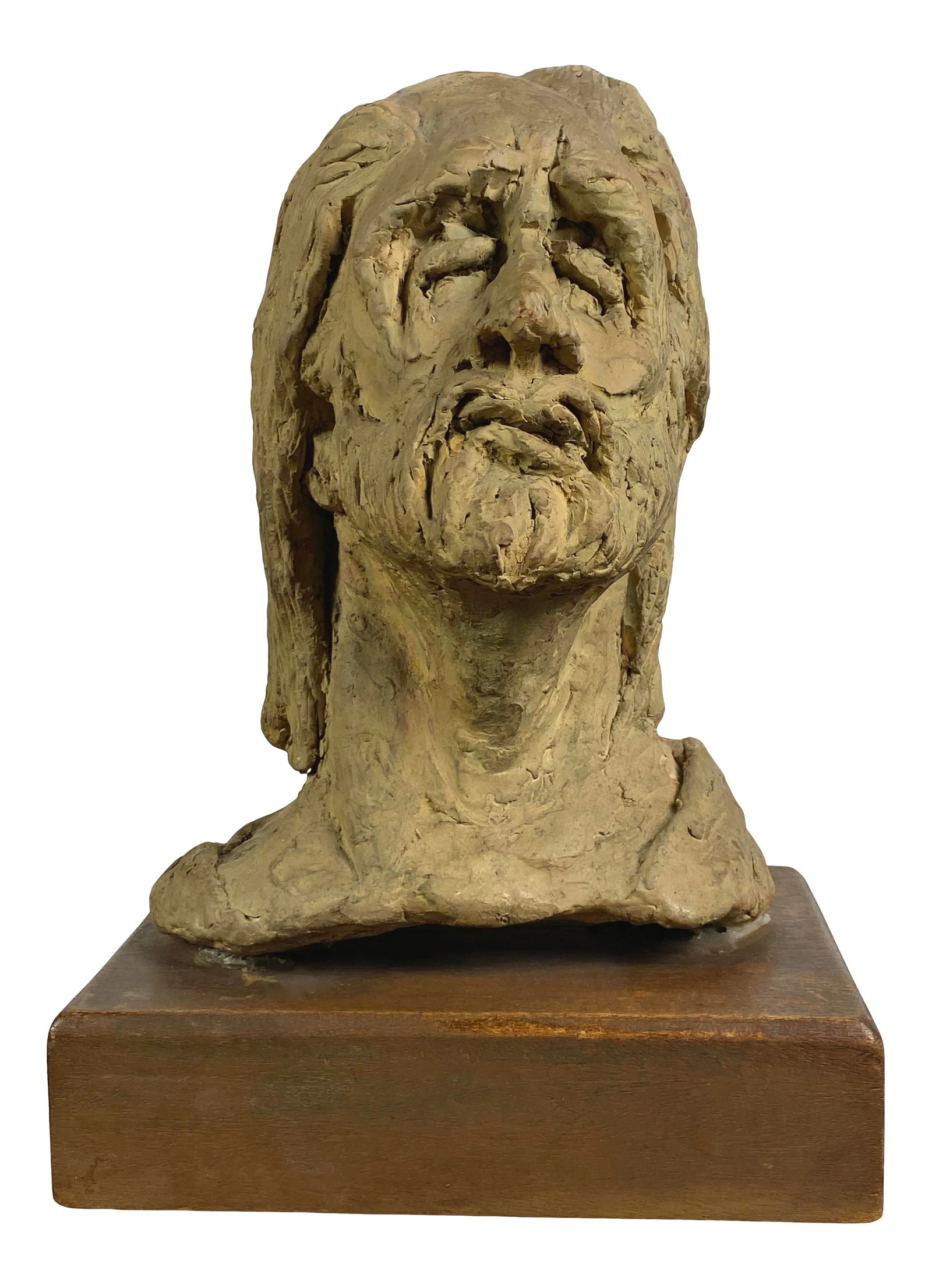 Late 20th Century Clay Bust Sculpture by Mary Hecht: Mary Hecht (Canadian, 1931-2013) Signed Bust Clay Sculpture on Wood Pedestal. Figurative clay sculpture with the initials "MOH" on back. In good condition. Wear conducive with age. Size: 14"H x 10"W x
