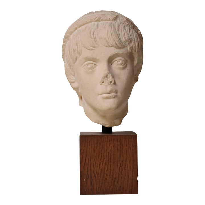 20th Century French Marble Sculpture (Child Portrait Bust): This 20th century French marble bust of a child is delicately carved and elegantly presented on a solid oak pedestal. Its gentle features and timeless craftsmanship make it a charming and refined