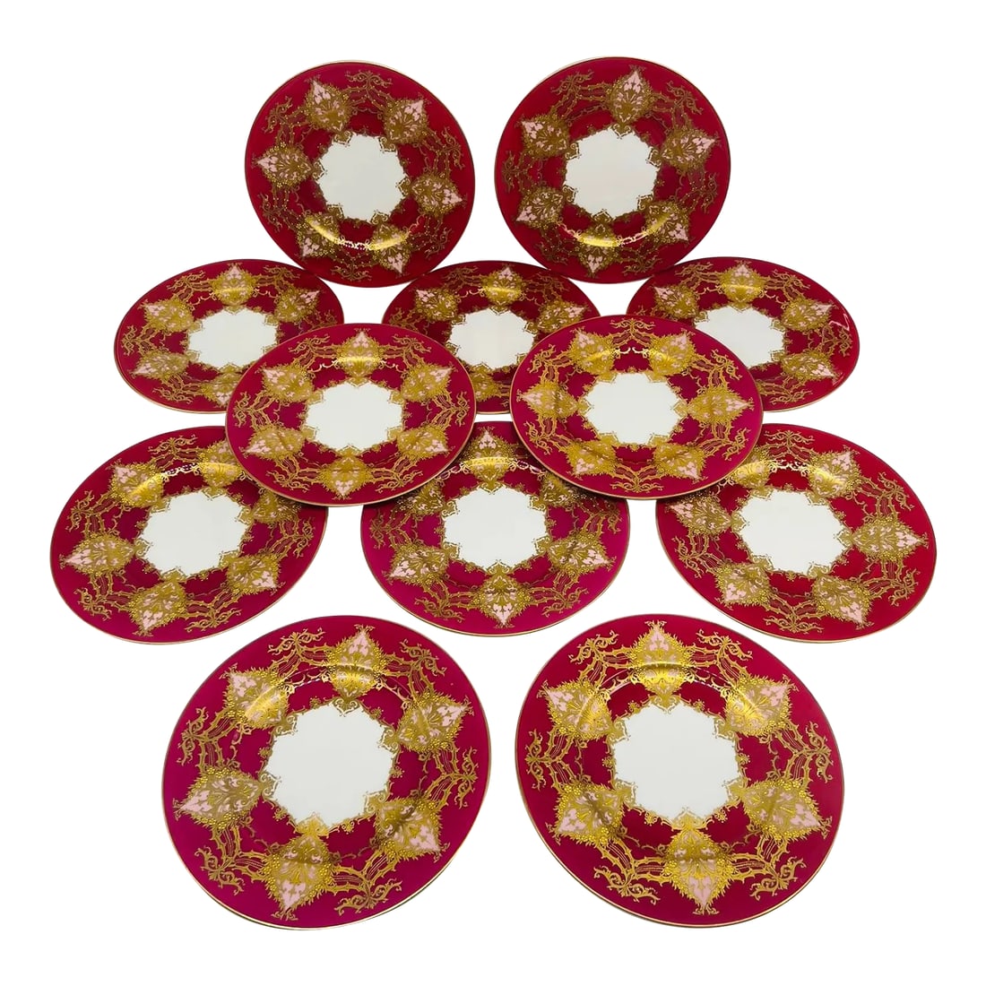 Set of 12 Royal Worcester Two- Tone Heavily Raised Gilt Decorated Dinner Plates: Set of 12 Royal Worcester Two- Tone Heavily Raised Gilt Decorated Dinner Plates. Each plate intricately decorated with raised jeweled gilding accenting the fine 6 pink tone windows presented across th