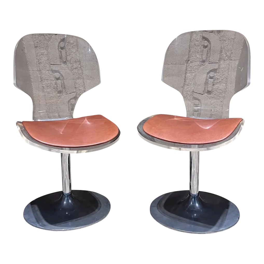 1980s Pair of Lucite and Chrome Swivel Dining Chairs: For your consideration, a pair of lucite and chrome plated swivel dining chairs (after Charles Hollis Jones) Made by Hill Manufacturing. USA circa the 1980s. Featured in Scarface film! Dimensions: