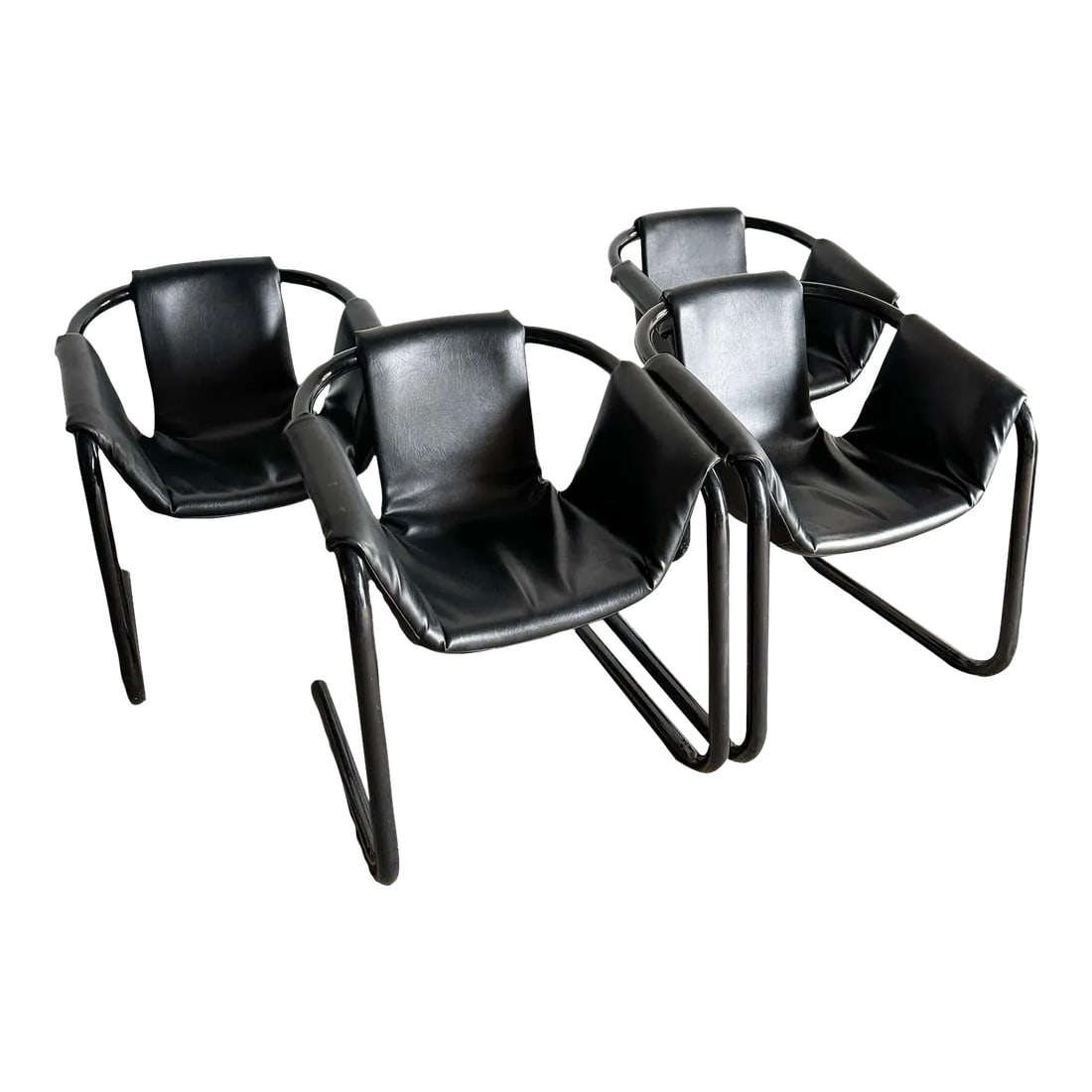 1970s Black Vinyl on Black Metal Zermatt Tubular Sling Chairs Vecta: Step back into the chic and sleek style of the 1970s with the Black Vinyl in Black Metal Zermatt Tubular Black Sling Chairs by Vecta. These chairs epitomize the bold and minimalist design aesthetic