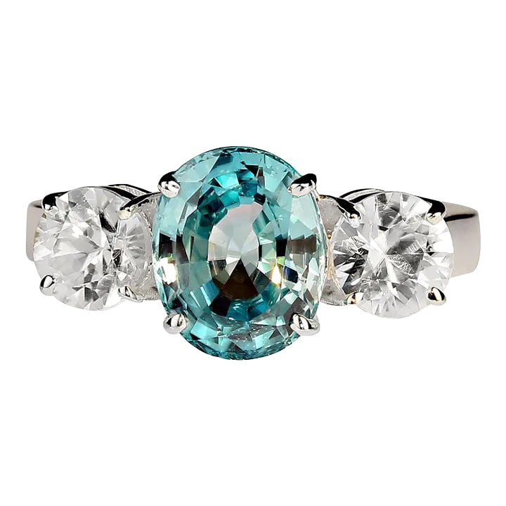 Zircons Classic Three Stone Ring Size 8: This is part of Chairish's Fine Jewelry assortment. Stunning 4.25ct Oval Blue Zircon Ring with Round Side Stones Elevate your jewelry collection with this gorgeous 4.25-carat oval blue zircon ring,