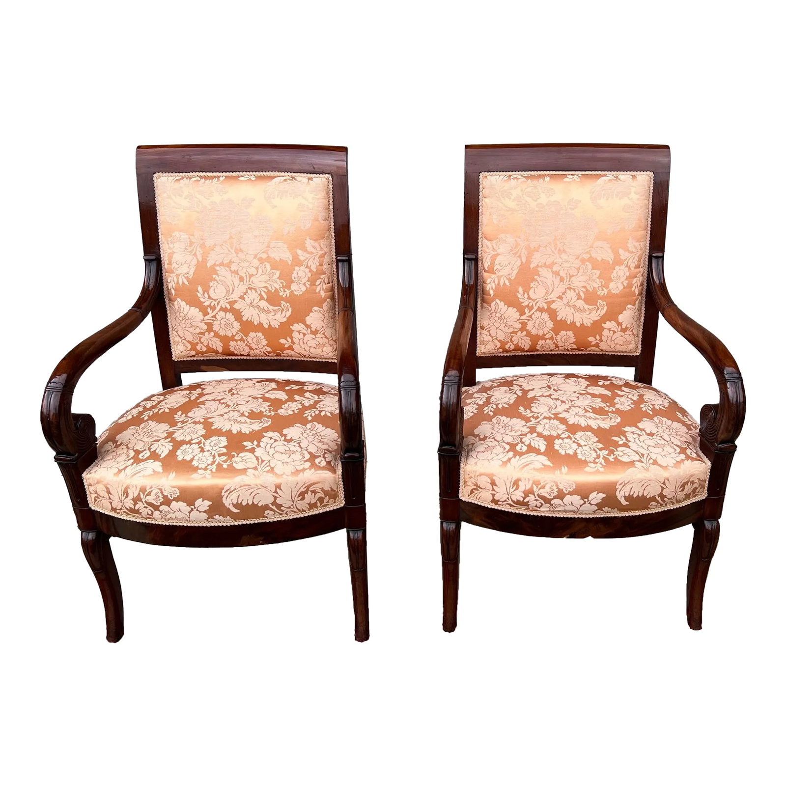 Pair of French Directoire Mahogany Carved Armchairs, Circa 1795: A Very Fine Pair of French Directoire Mahogany Carved Armchairs, Circa 1795 Made in France, circa 1795-1810 Carved arms, and klismos front legs, and carved knees. Peach-y/pink-y coloured upholstery.