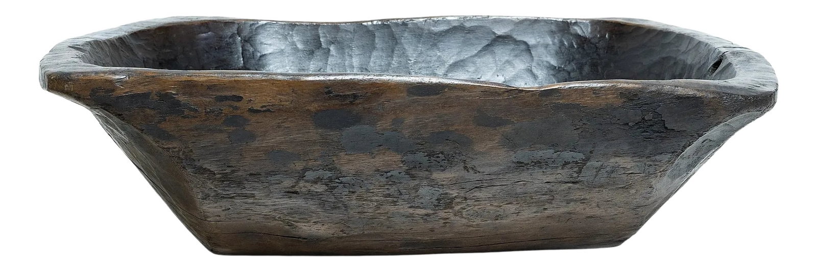 Large Provincial Chinese Farm Tray, c. 1900: This wooden farm tray from northern China charms with its rustic finish and asymmetrical form. Hand-carved from a single block of wood, the large tray is truly one-of-a-kind, shaped with a deep basin
