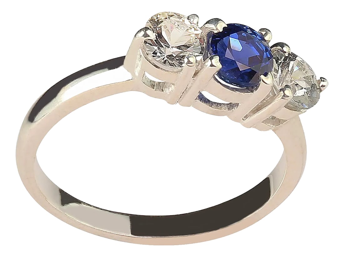 Sparkling Classic Three-Stone Blue and White Sapphire Ring: Classic Three-Stone Sapphire Ring in Sterling Silver Elevate your style with this timeless three-stone ring featuring a sparkling blue sapphire and two brilliant white sapphires. Crafted in sterling