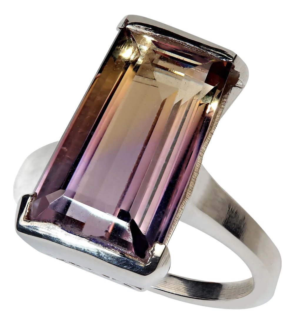 10 Carat Awesome Ametrine Trapezoid Sterling Silver Ring: Make a bold statement with this 10-carat Ametrine trapezoid-cut ring, crafted from Sterling Silver with a distinctive half-bezel setting. The innovative design leaves the sides open, allowing light