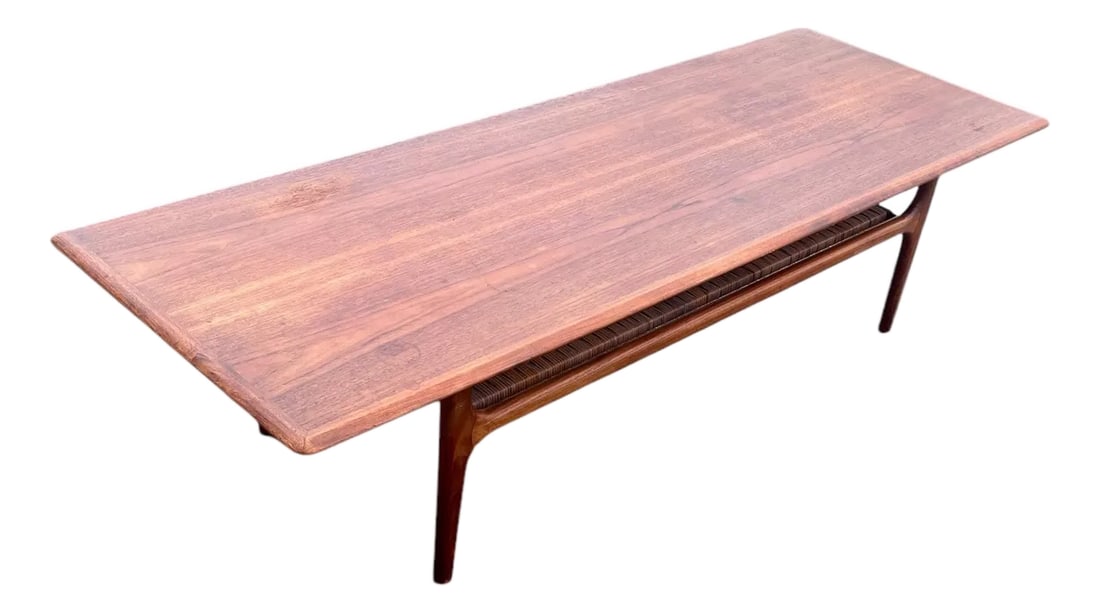1960's Vintage Danish Modern Teak Coffee Table by Trioh: Mid Century Modern Vintage Teak Coffee Table by Trioh Mobler . This Danish, modern tea, coffee table features quality, Scandinavian construction with a second cane tier for added storage makers mark