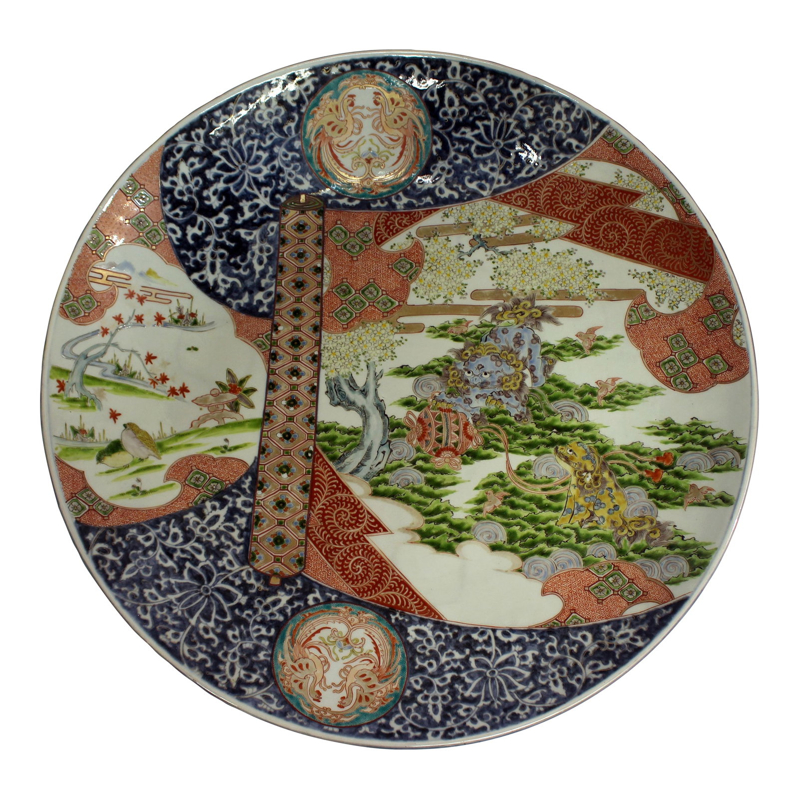 Circa 1860-80 Japanese Imari Grand Scale Charger: Circa 1860-80 Japanese Imari Grand Scale Charger. Meiji period. Superbly decorated with naturalistic reserves & asymmetric diapered panels; note the foo dog pair. 24.25" dia., 3 3/8" h. Condition: