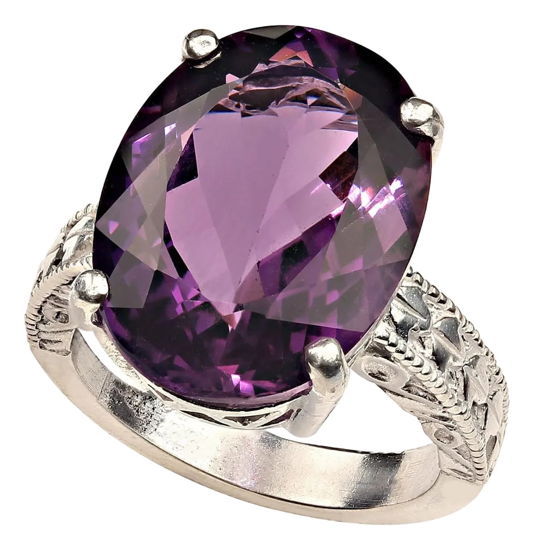Ajd Dazzling Oval Amethyst in Sterling Silver Engraved Ring February Birthstone, Size 7: Dazzling oval Amethyst, 12.8 carats, set in 4 prong engraved Sterling Silver ring in perfect for all occaisions. This brilliant gemstone comes from our favorite supplier up in the mountains outside of