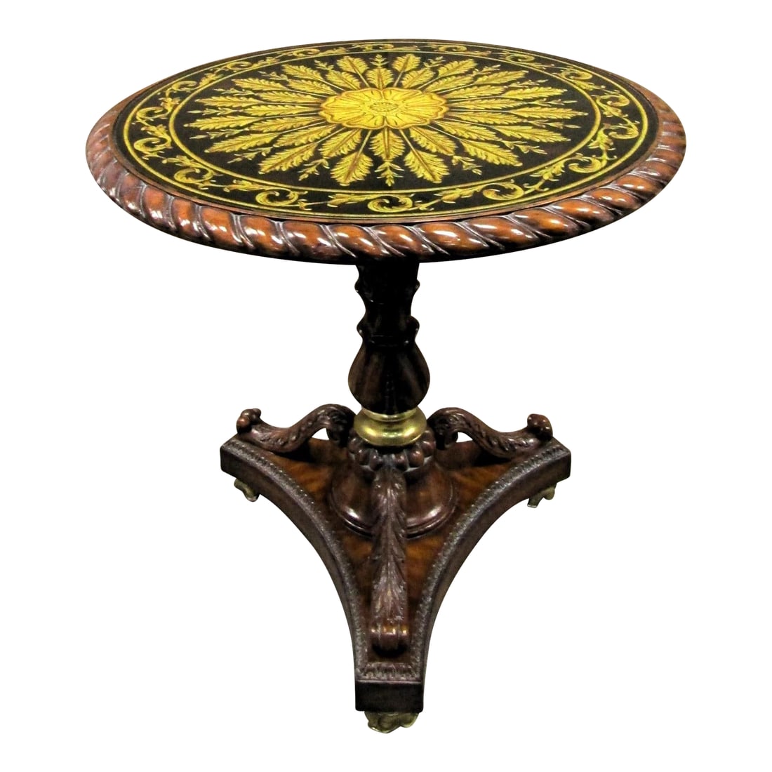 Maitland-Smith Verre Eglomise Reverse Painted Glass Table With Lotus Blossom Brass Feet 1980s: The Maitland-Smith Reverse Painted Glass Table with Lotus Blossom Brass Feet from the 1980s is a stunning accent table perfect for any living room. The round tabletop made of glass with a medium wood