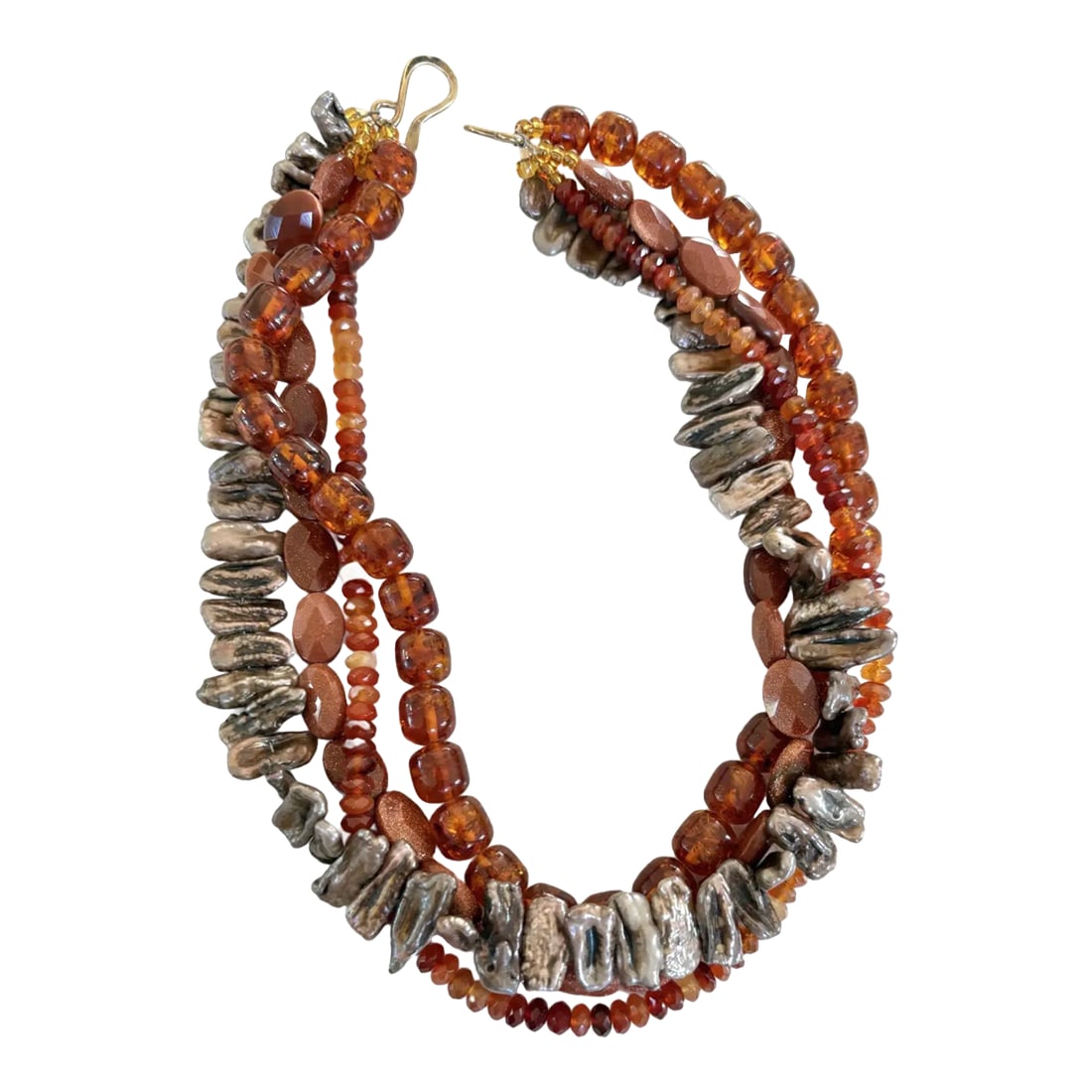 Vintage Multi-Strand Freshwater Pearl, Carnelian Amber, and Goldtone Beaded Necklace: Stunning, four strand necklace featuring a collection of faceted carnelian beads, uniquely shaped freshwater pearls (each unique in size and shape), rich red amber beads, and gold tone spacers. The