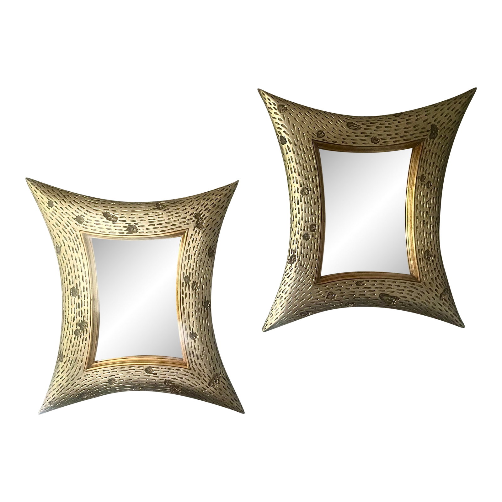 Pair of Christopher Guy Diamond Wall Mirrors in Mahogany With Beveled Glass: A striking pair of sculptural four-point mirrors attributed to the style of Christopher Guy. Each frame showcases an expressive, elongated silhouette finished in a beautifully aged silver patina,