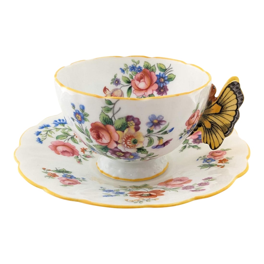 Rare Vintage Aynsley Teacup and Saucer With Yellow Butterfly Handle: Rare vintage Aynsley teacup and saucer with beautiful yellow butterfly handle and floral design. Each image is hand painted with immaculate detail. Made in England. In mint condition with no chips,
