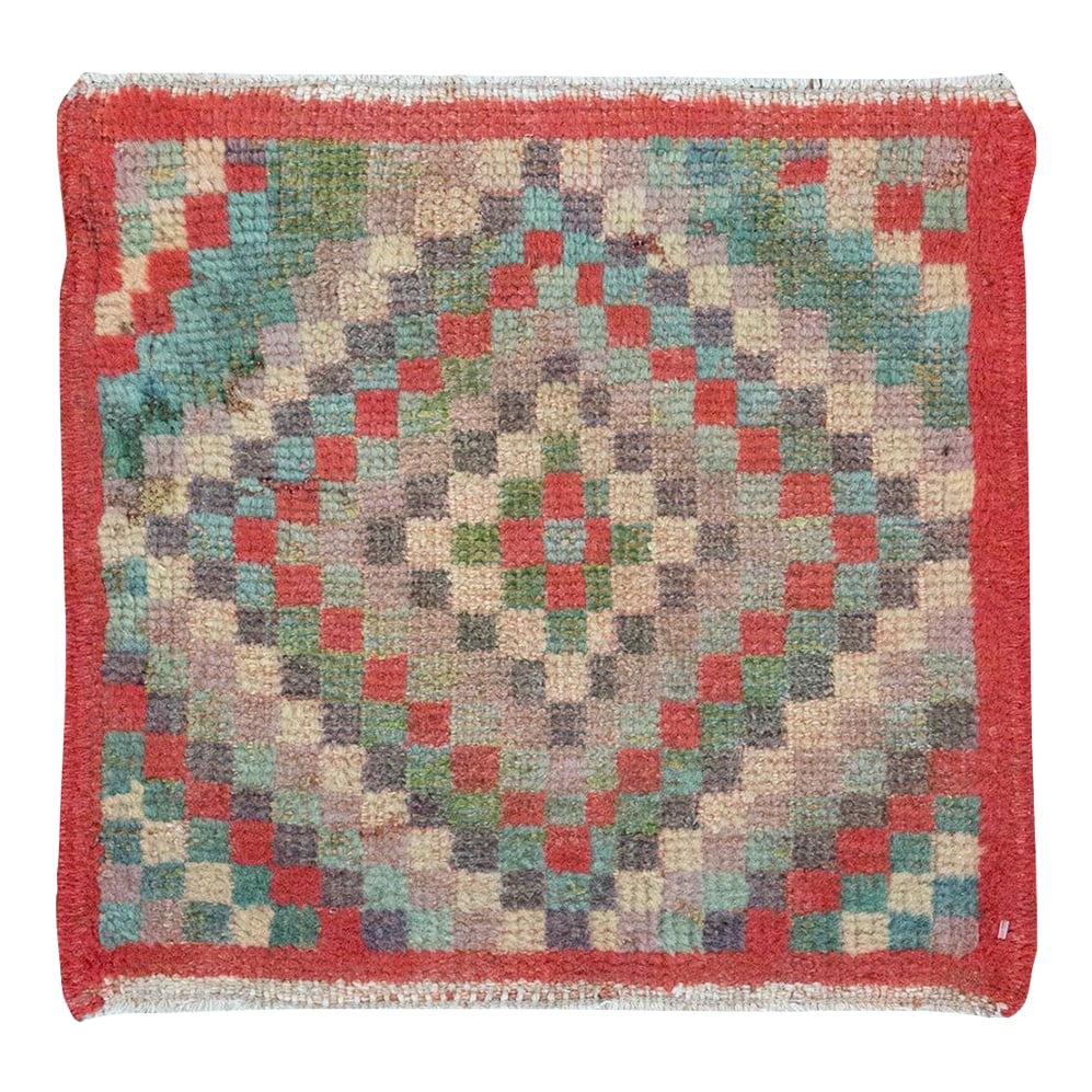 Galerie Shabab Collection Mid-20th Century Turkish Anatolian Rug: This mid-20th-century Turkish Anatolian rug, measuring 1' 6" × 1' 6", captures the spirit of rural weaving with its vibrant color palette and geometric simplicity. The composition features a