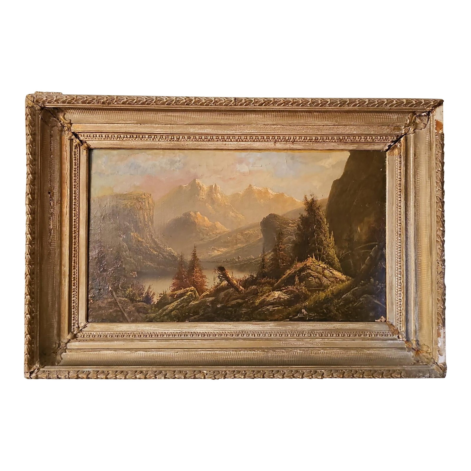 Large Antique Mountain Landscape Painting, Oil on Canvas, C. 1900, Antique Frame: This is a 19th-century oil painting of a mountain landscape attributed to Albert Bierstadt. The painting depicts a serene alpine scene with towering mountains, a lake, and a forest. The style of the p