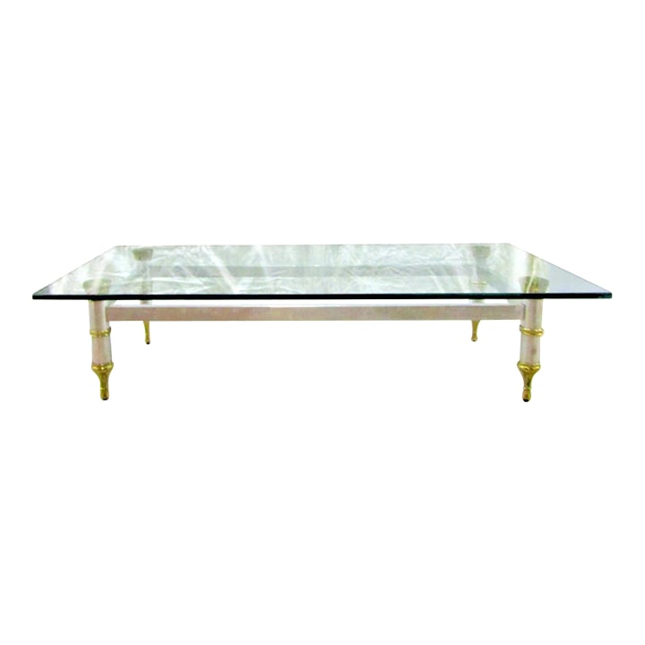 1960's Maison Jansen 78" Aluminum With Brass Accent Thick Beveled Glass Cocktail Table: 1960's Maison Jansen 78" Aluminum with Brass Accent Thick Glass Cocktail Table Overall measures 78" long, 30" wide and 16" tall. The table base measures 58" long, 24" wide and 15" tall. The beveled