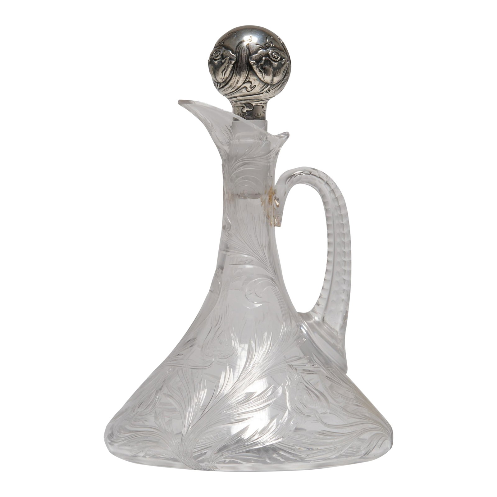 Early 20th Century Art Nouveau Cut Glass Ships Decanter With a Sterling Silver Mounted Stopper, Theo: This gorgeous art nouveau ships decanter is cut with trailing poppy flowers and leaves. It has a slice cut loop handle and a star cut base. The globular, sterling silver stopper is chased and