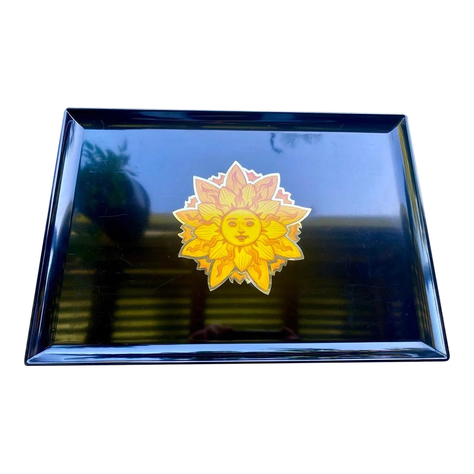Rare Vintage Couroc Sunburst Face Tray – Bohemian Hollywood Regency: Vintage Couroc of Monterey serving tray featuring a radiant stylized sun face motif rendered in warm golden and amber-toned inlay against Couroc's iconic black surface. This striking celestial design
