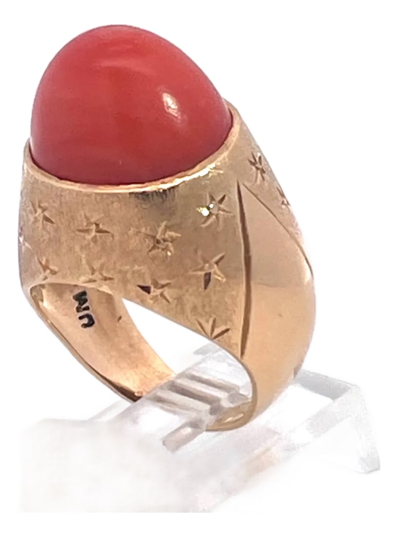1940s Yellow Gold Mediterranean Coral Cocktail Ring, Unique Design, Size 6.5: This impressive vintage cocktail ring showcases a large oval cabochon of rich Mediterranean coral, its deep warm orange tones glowing beautifully against a substantial yellow gold mount. This stone