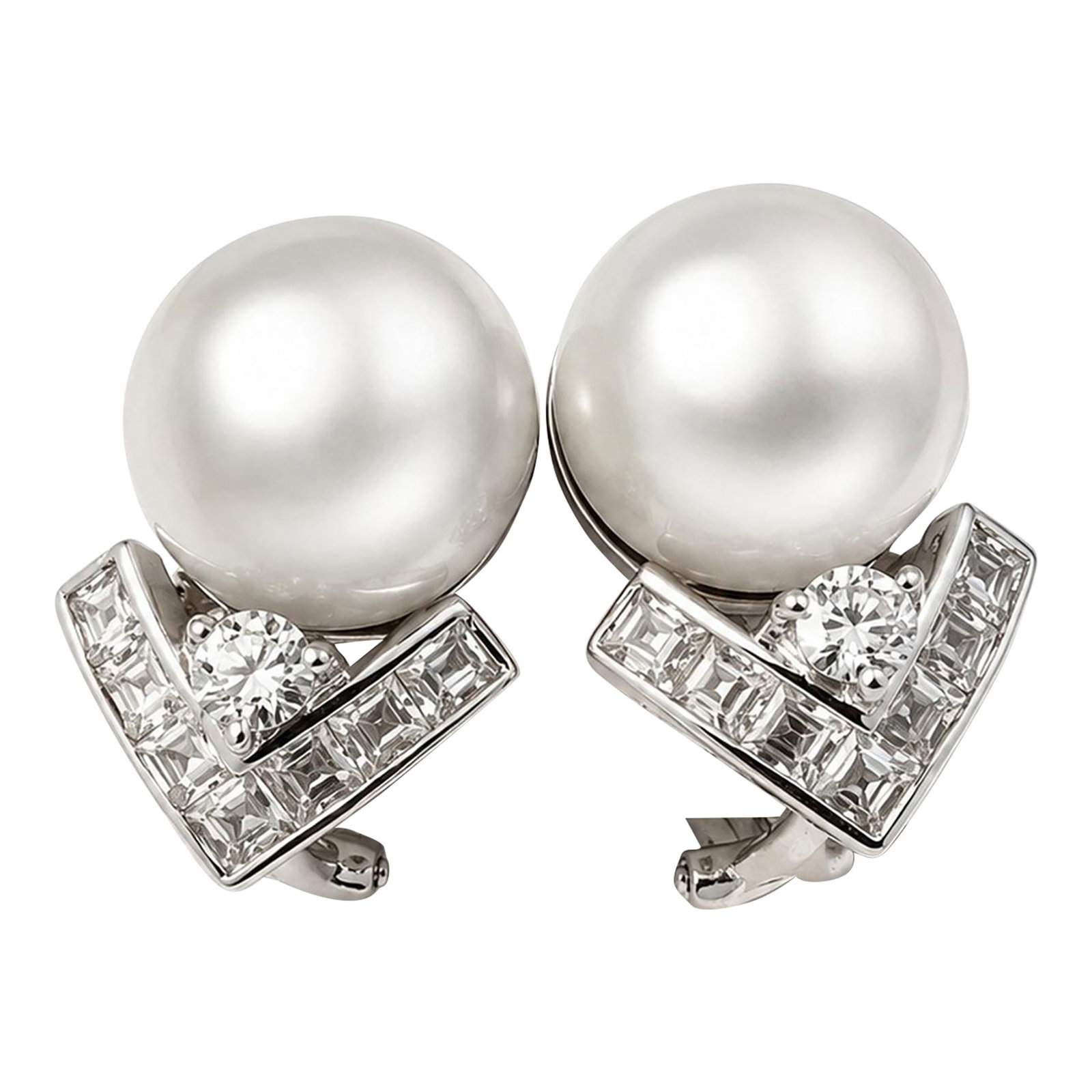 18k White Gold South Sea Pearl Diamond Earrings, A Pair: Luxurious 18K white gold earrings featuring luminous 13.1mm South Sea pearls accented by 3.25 carats total weight of round brilliant and baguette-cut diamonds. The elegant chevron-inspired design