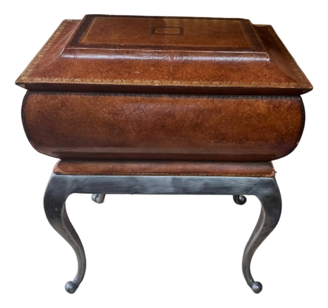 1980s Maitland-Smith Leather Covered Decorative Box on Hand-Forged Iron Stand: Elegant vintage Maitland-Smith decorative box featuring a hand-finished marbled leather exterior with gilt-tooled accents and a fitted hand-forged iron stand. The interior is lined with a beautifully