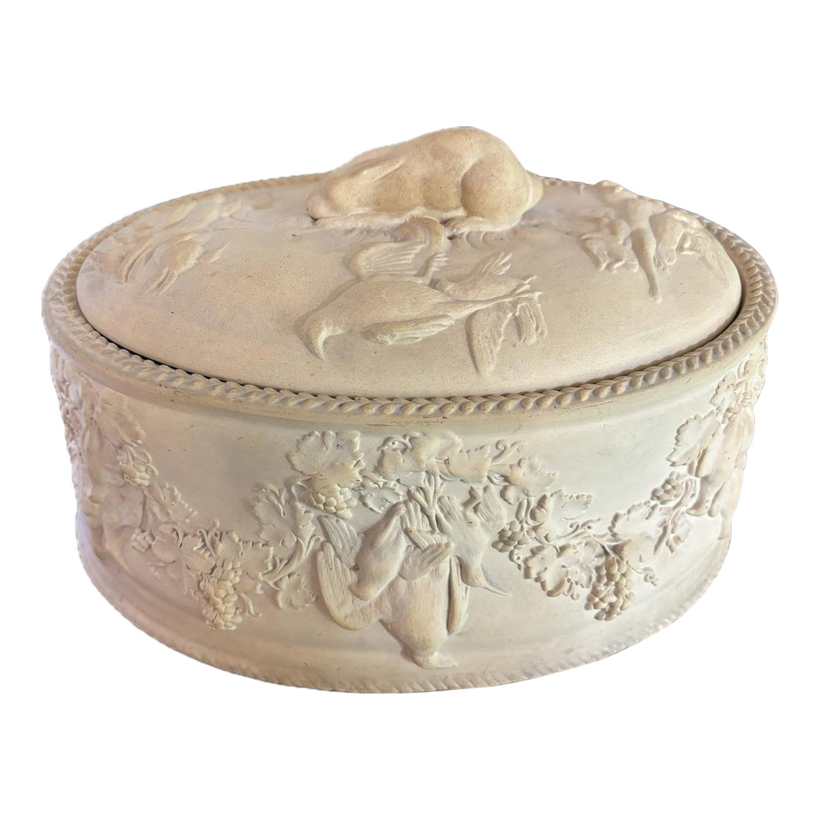 Mid 20th Century Signed Wedgewood Cane Ware Game Pie Tureen or Serving Dish With Cover and Insert: Charming and highly decorative bisque or cream earthenware covered tureen or game pie dish featuring richly molded game, grapevine swags and hunt and fruit motifs in relief. The oval buff colored